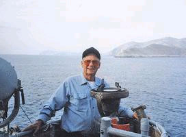G White on 325.jpg - George White, USMCGeorge poses off the coast of Sicily on the USS LST 325 while helping bring the ship back to the United States from Greece in 2001. (G White family photos)